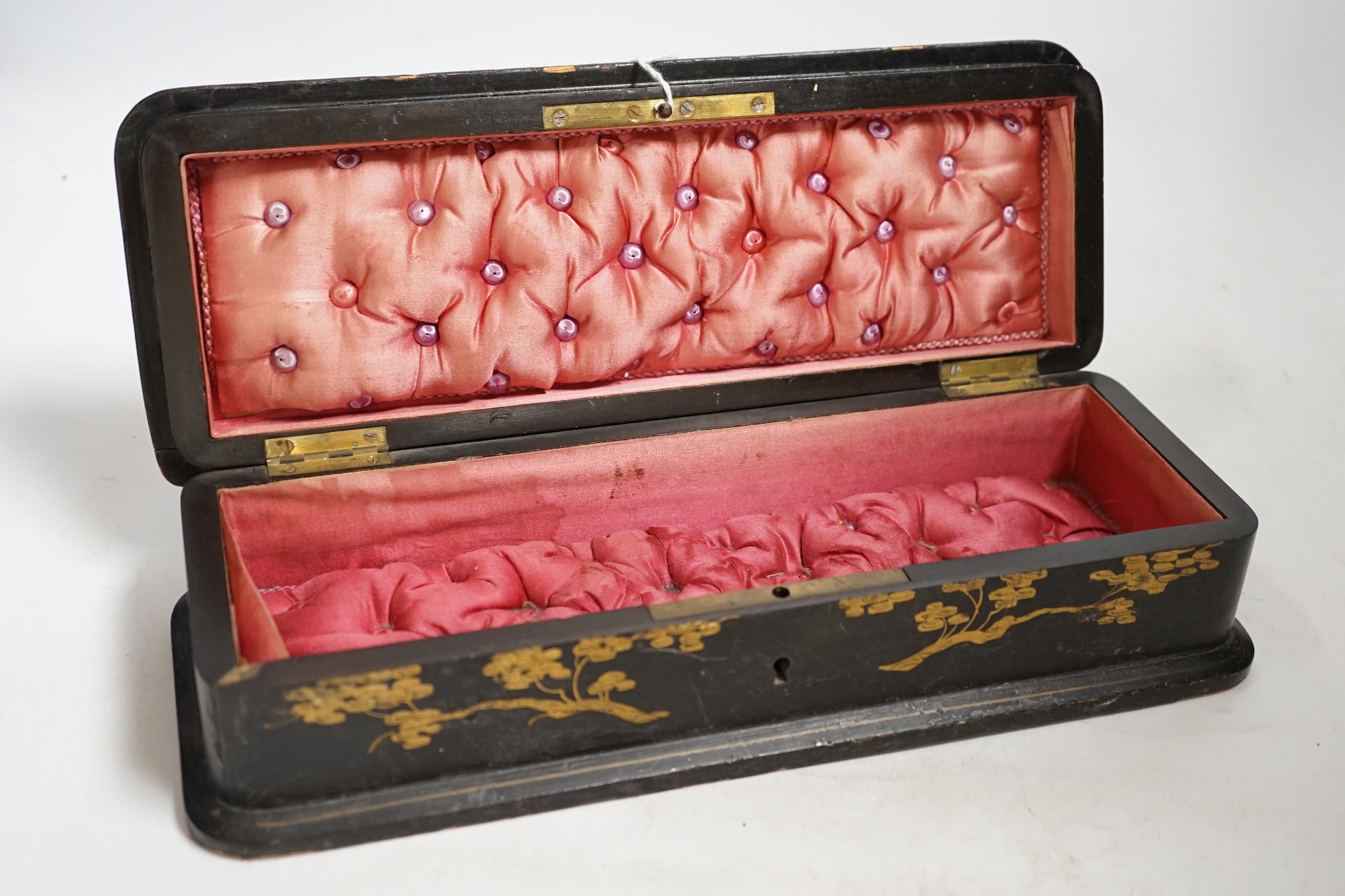 A French japanned papier maché glove box together with a tortoiseshell card case inlaid with white and yellow metal, largest 30cm wide. Condition- fair
